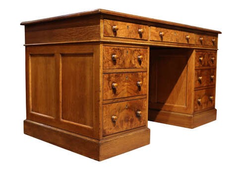 A Victorian burr walnut pedestal desk featuring nine drawers with turned wooden knobs and a red leather gilt-tooled writing surface. View III