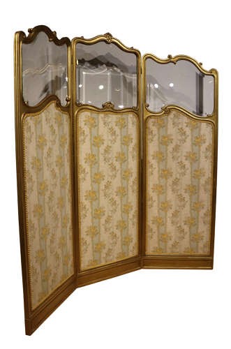 A three-panel French giltwood folding screen featuring shaped bevelled glass top sections and floral-patterned beige silk lower panels. View II