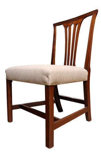 A set of six Georgian mahogany dining chairs featuring carved crest rails, vertical back splats, square legs with stretchers, and beige upholstered seats. View V
