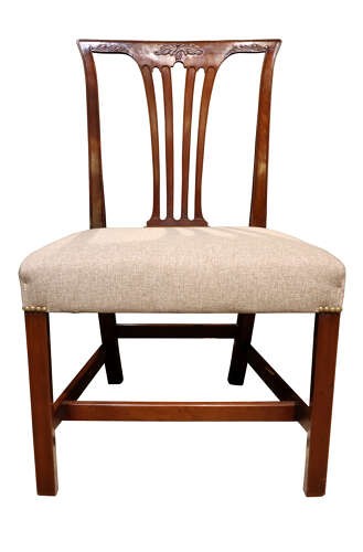 A set of six Georgian mahogany dining chairs featuring carved crest rails, vertical back splats, square legs with stretchers, and beige upholstered seats. View VI