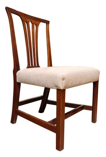 A set of six Georgian mahogany dining chairs featuring carved crest rails, vertical back splats, square legs with stretchers, and beige upholstered seats. View VII