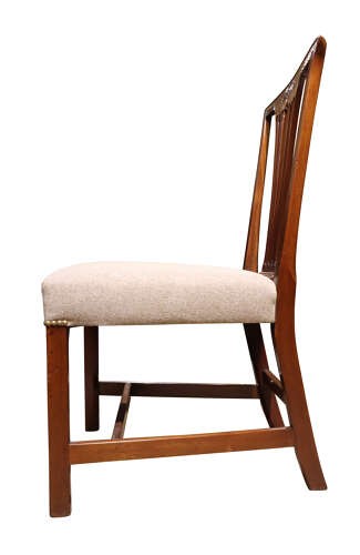 A set of six Georgian mahogany dining chairs featuring carved crest rails, vertical back splats, square legs with stretchers, and beige upholstered seats. View VIII