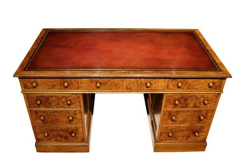 A Victorian oak and burr walnut pedestal desk featuring nine drawers with turned timber knobs and a central kneehole. View III
