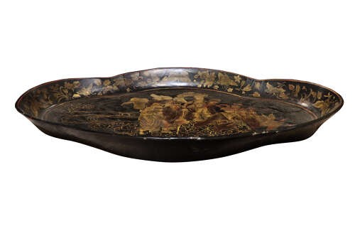An oval black lacquered tray featuring gilt Chinoiserie decoration of figures on clouds surrounded by a floral border. View II