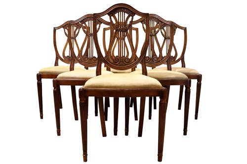 A set of eight mahogany dining chairs with carved lyre backs, fluted legs, and neutral upholstered seats. View III