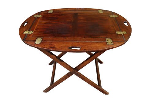 A William IV mahogany butlers tray with carved cutout handles situated on an X-frame folding wooden stand. View V