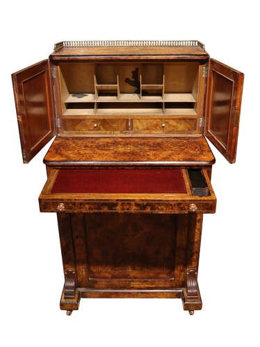 A Victorian burr walnut bureau de dame featuring intricate brass inlay, a top cabinet with twin doors, a full-width drawer, and a lower cupboard set on castors. View V