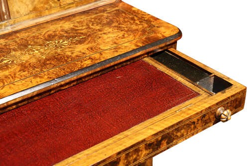 A Victorian burr walnut bureau de dame featuring intricate brass inlay, a top cabinet with twin doors, a full-width drawer, and a lower cupboard set on castors. View VII
