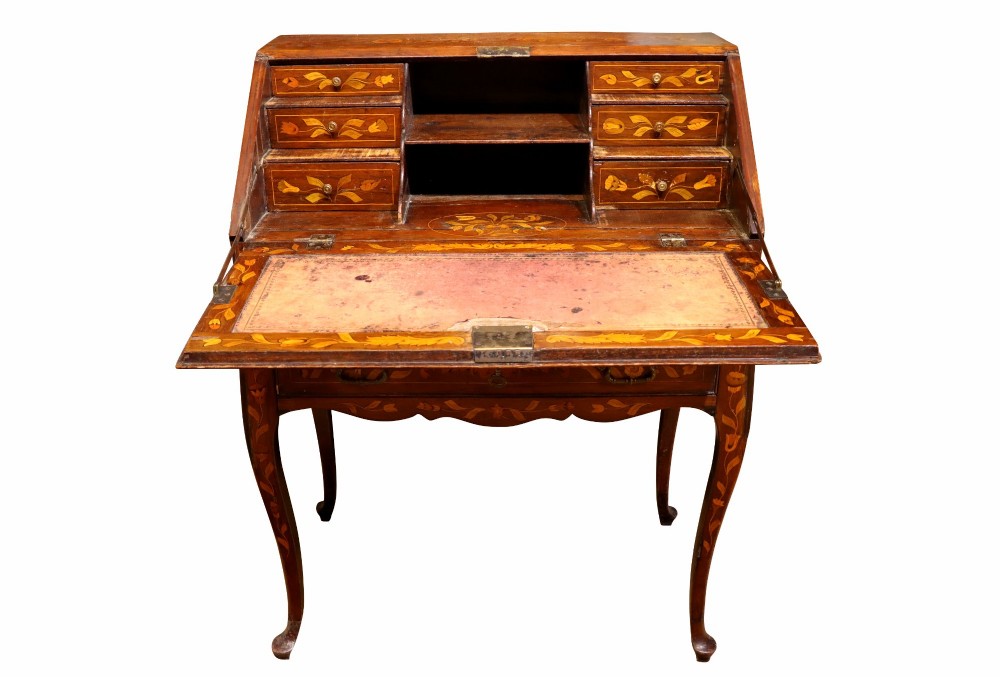 An 18th-century Dutch bureau featuring intricate floral wood marquetry, a sloped fall front, drawers with brass handles, and cabriole legs. View V