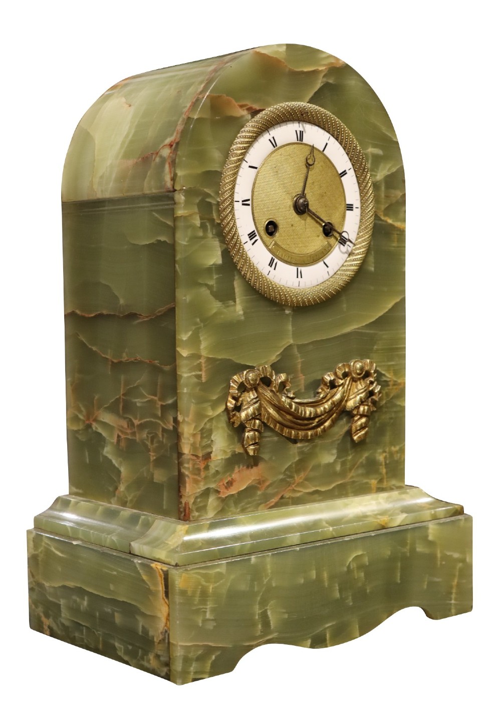 An early nineteenth-century French mantel clock constructed from polished green onyx with an arched case, gilt-bronze ribbon swag mount, and a central dial with Roman numerals. View II