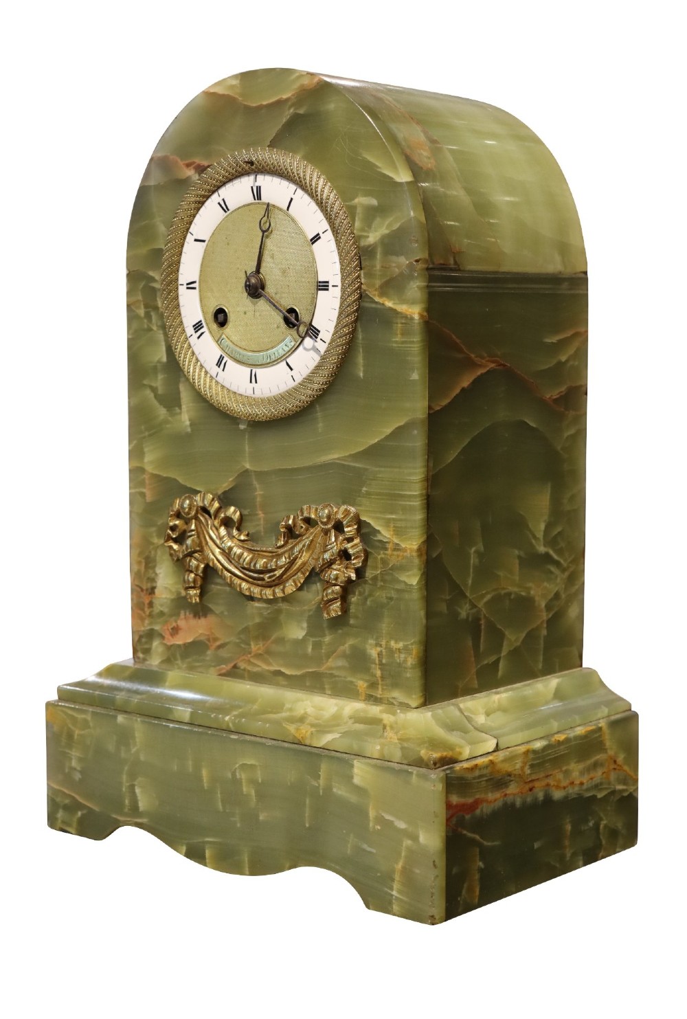 An early nineteenth-century French mantel clock constructed from polished green onyx with an arched case, gilt-bronze ribbon swag mount, and a central dial with Roman numerals. View IV