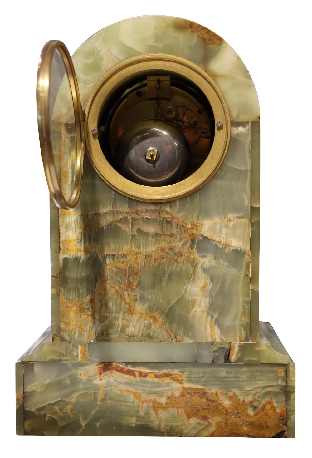 An early nineteenth-century French mantel clock constructed from polished green onyx with an arched case, gilt-bronze ribbon swag mount, and a central dial with Roman numerals. View V