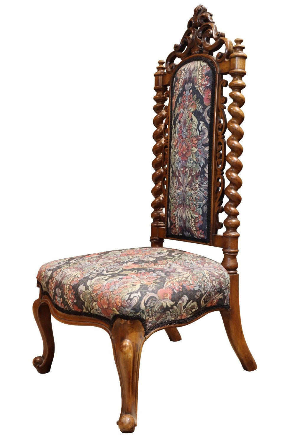 A Victorian carved walnut side chair featuring barley twist columns, a carved scroll cresting rail, cabriole front legs, and floral tapestry upholstery. View II