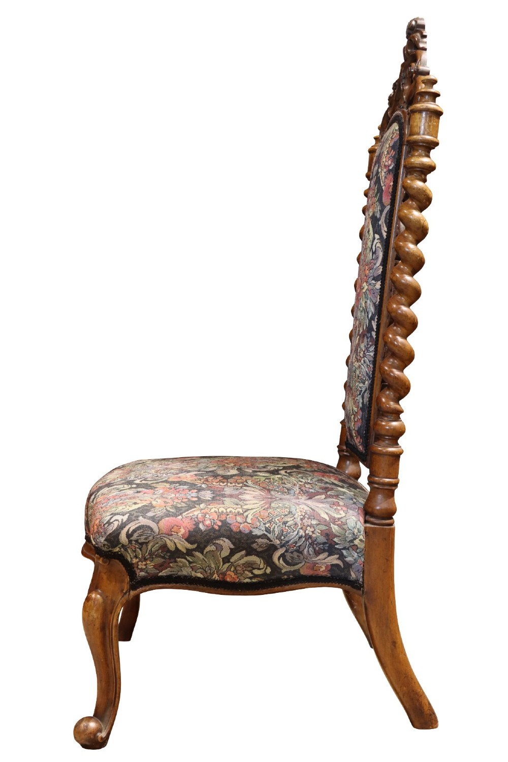 A Victorian carved walnut side chair featuring barley twist columns, a carved scroll cresting rail, cabriole front legs, and floral tapestry upholstery. View III