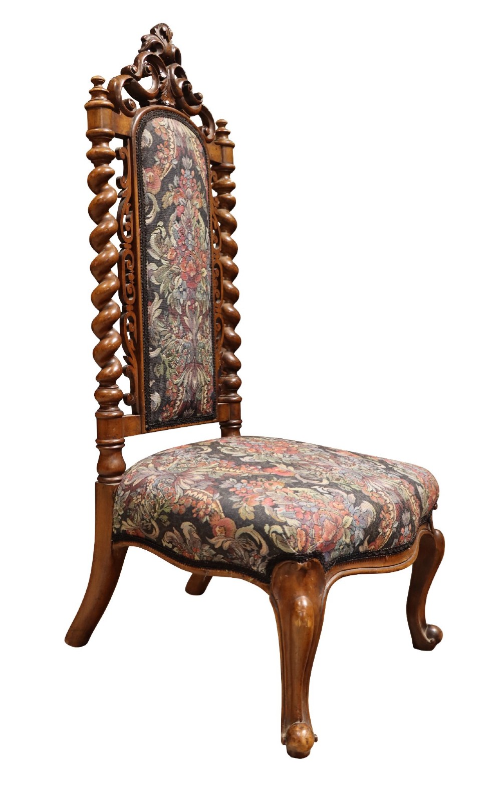 A Victorian carved walnut side chair featuring barley twist columns, a carved scroll cresting rail, cabriole front legs, and floral tapestry upholstery. View IV
