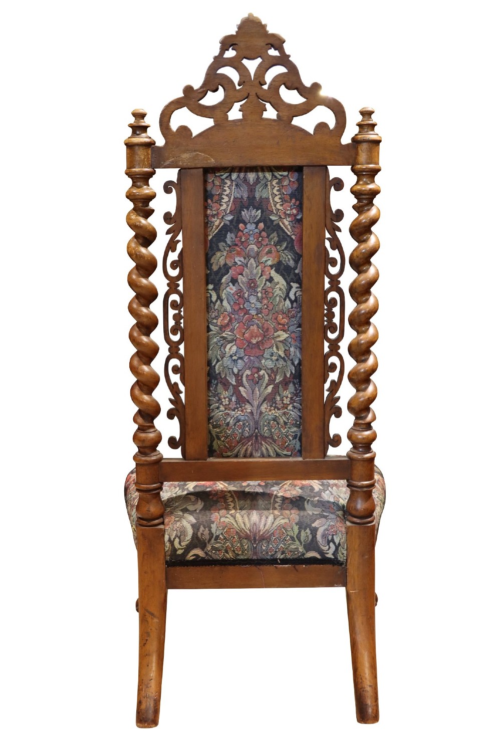 A Victorian carved walnut side chair featuring barley twist columns, a carved scroll cresting rail, cabriole front legs, and floral tapestry upholstery. View V