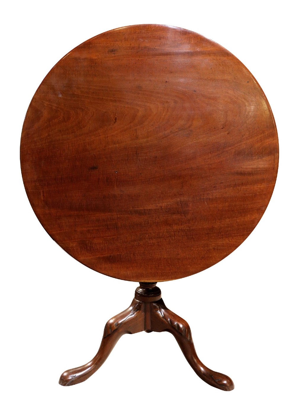 A George IV circular mahogany tilt-top table featuring a turned central column with carved detailing and a tripod base resting on pad feet. View II