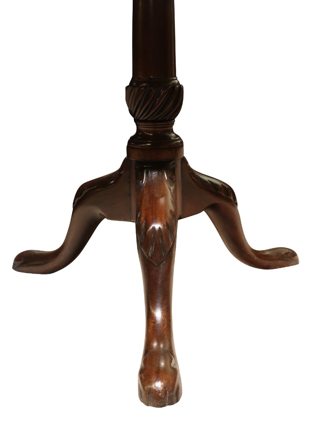 A George IV circular mahogany tilt-top table featuring a turned central column with carved detailing and a tripod base resting on pad feet. View V