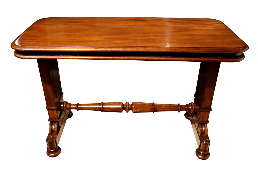 A William IV polished mahogany three-tier buffet table featuring a mechanical rise and fall shelf structure supported by double upright columns and a carved trestle base. View V