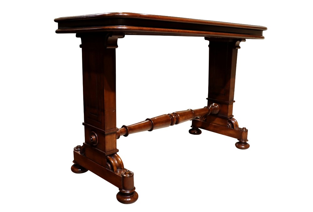 A William IV polished mahogany three-tier buffet table featuring a mechanical rise and fall shelf structure supported by double upright columns and a carved trestle base. View VII