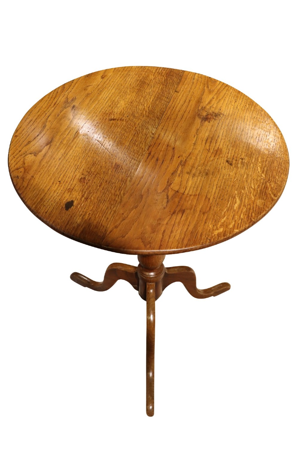 An 18th-century Early Georgian circular occasional table made of warm brown elm wood with a turned central column and three cabriole legs. View IV