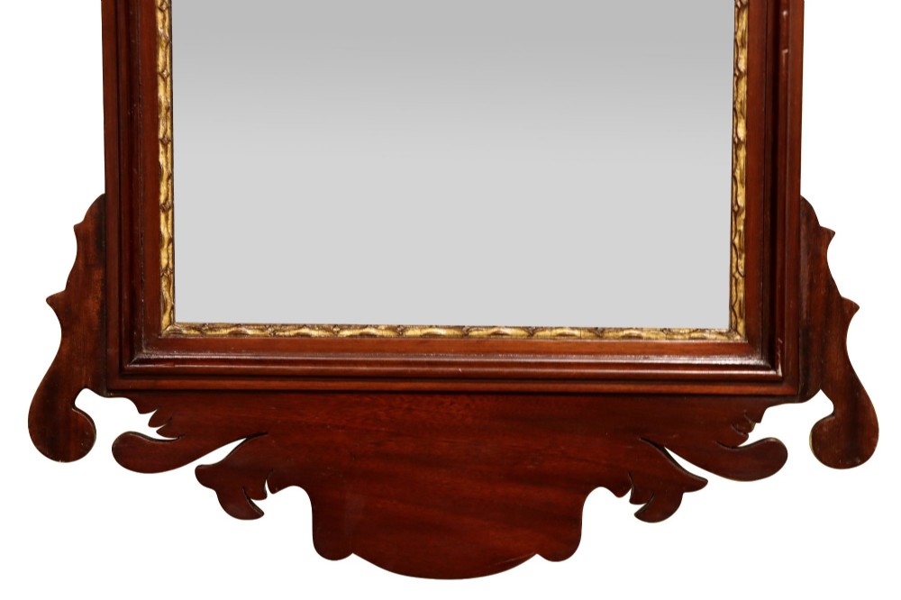 A Victorian Chippendale style mahogany wall mirror featuring decorative fretwork scroll cresting and a gilded inner slip border. View III