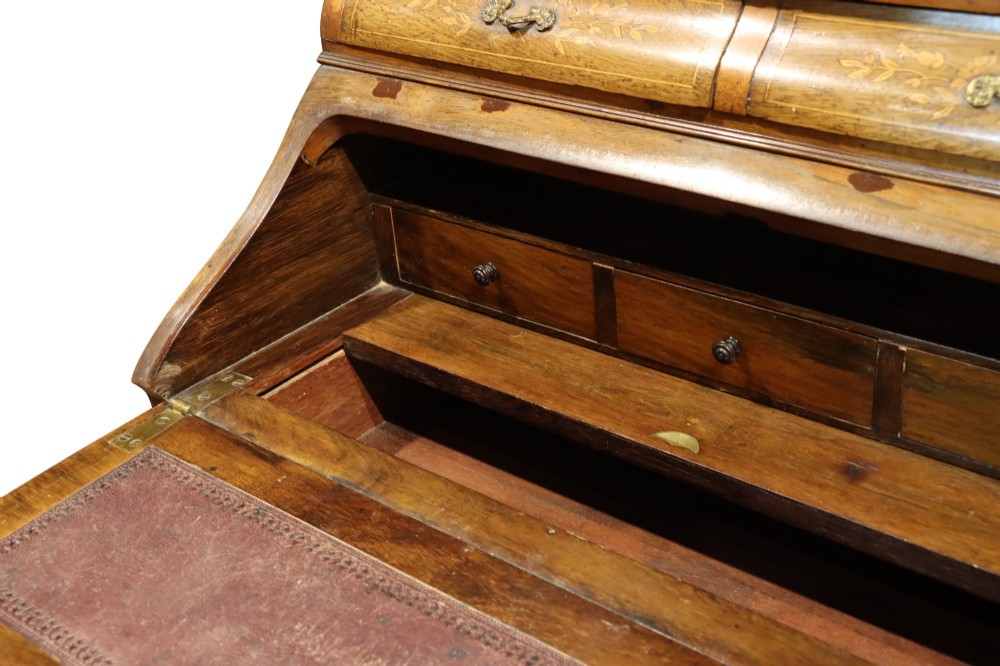 A 19th-century French Louis XV style bonheur-du-jour writing desk featuring floral marquetry inlay, slender cabriole legs, a slant-front writing slope, and brass mounts. View VI