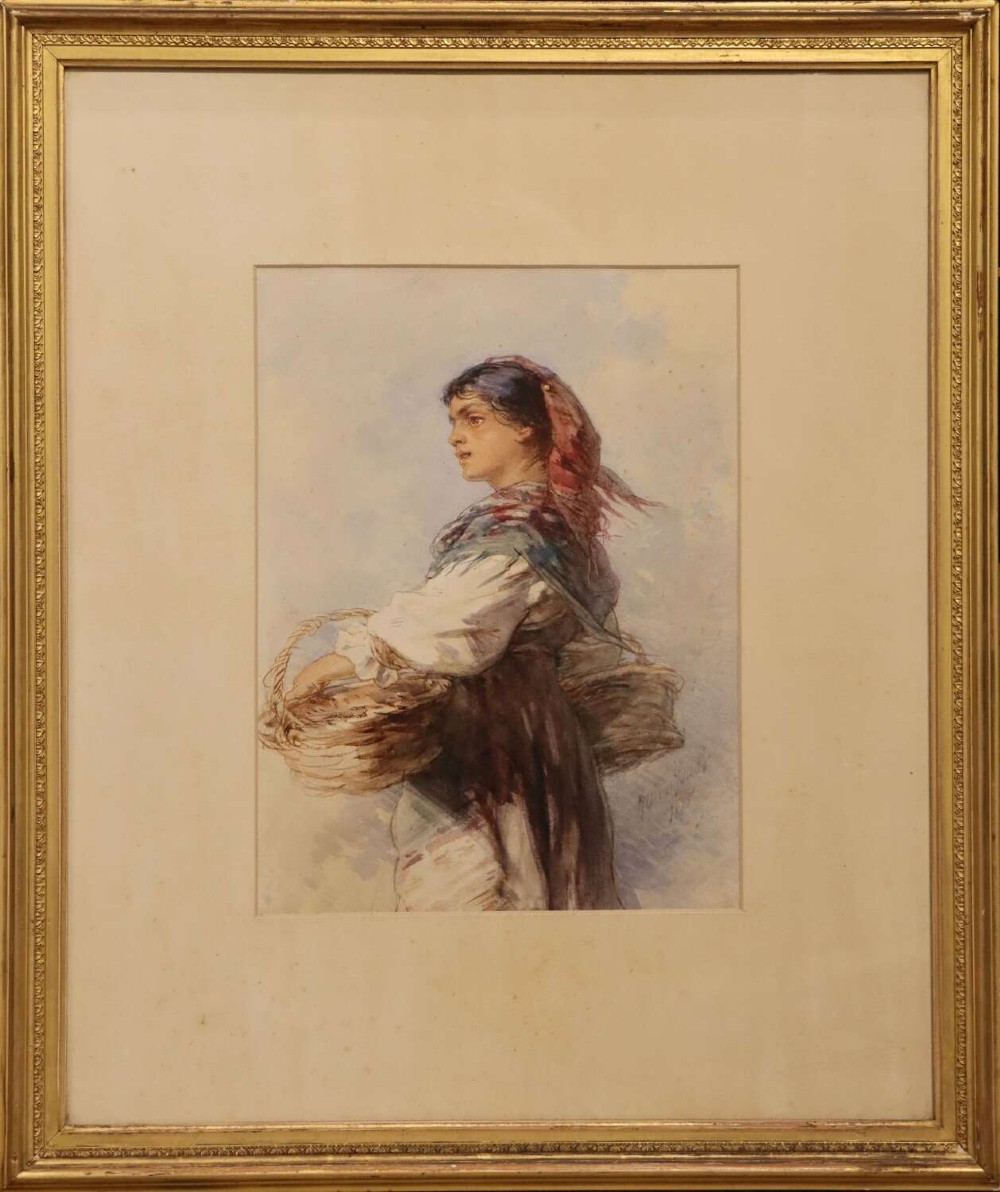 A framed 19th-century watercolour painting depicting an Italian peasant woman wearing traditional attire and carrying woven baskets.