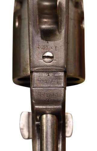 An antique Colt Model 1851 Navy percussion revolver featuring a grey steel frame, an octagonal barrel, a six-shot cylinder, and a dark walnut grip. View IV