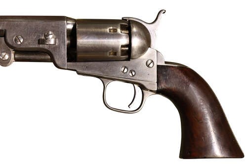An antique Colt Model 1851 Navy percussion revolver featuring a grey steel frame, an octagonal barrel, a six-shot cylinder, and a dark walnut grip. View VII