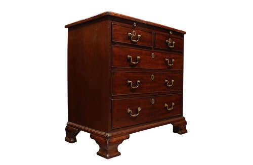 A George III mahogany chest of drawers featuring brass swan-neck handles, an upper brushing slide, and bracket feet. View II