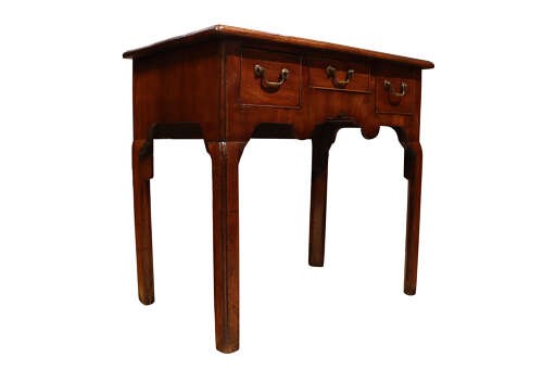 A George II mahogany lowboy table featuring three drawers with brass swan-neck handles and a shaped lower apron. View II