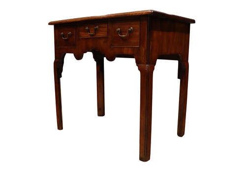 A George II mahogany lowboy table featuring three drawers with brass swan-neck handles and a shaped lower apron. View IV