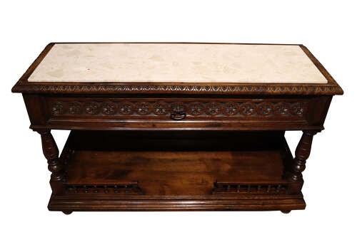 A French Henri II style dark oak enfilade with a carved frieze drawer, turned column supports, and an open lower shelf framed by a spindle rail. View II