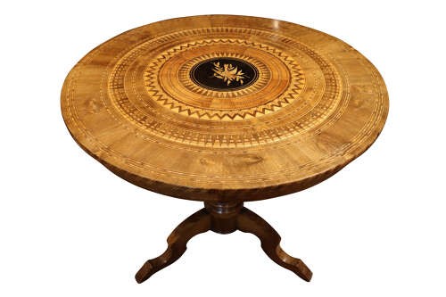 A circular walnut occasional table featuring intricate geometric parquetry and marquetry inlay on a turned central pedestal with three splayed legs. View V