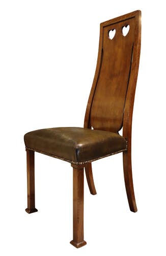 A set of six Arts and Crafts solid oak dining chairs featuring tall backsplats with heart-shaped cutouts and green leather seats with brass studding. View VII