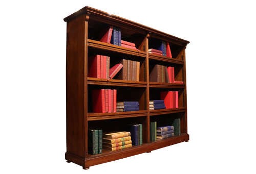 A wide Edwardian mahogany double-width open bookcase featuring adjustable shelves, a moulded cornice, and a sturdy plinth base. View II