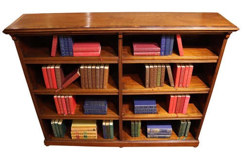 A wide Edwardian mahogany double-width open bookcase featuring adjustable shelves, a moulded cornice, and a sturdy plinth base. View III