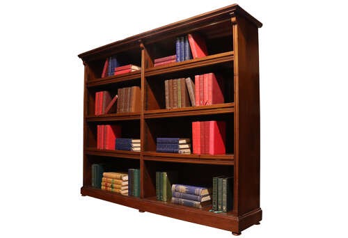 A wide Edwardian mahogany double-width open bookcase featuring adjustable shelves, a moulded cornice, and a sturdy plinth base. View IV