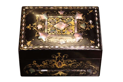 A black lacquered Victorian sloped stationery box adorned with gold leaf scrollwork and mother-of-pearl inlay. View IV
