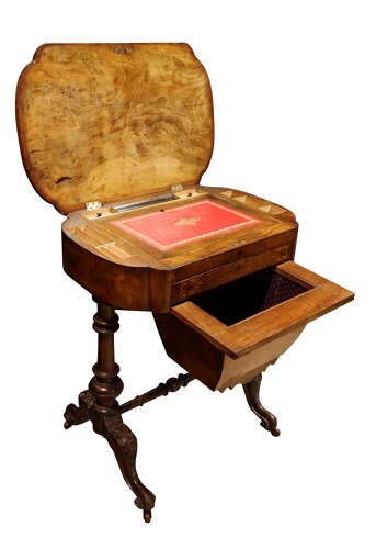 A Victorian burr walnut sewing table featuring intricate marquetry inlay on top, turned legs with carved feet, and a drop-down sewing well beneath a single drawer. View II