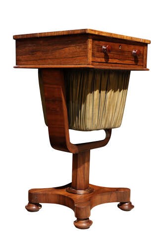 A William IV rosewood pedestal sewing table featuring a single top drawer, a pleated fabric work well suspended from a U-shaped frame, and a quadform base. View III