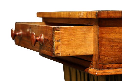 A William IV rosewood pedestal sewing table featuring a single top drawer, a pleated fabric work well suspended from a U-shaped frame, and a quadform base. View V