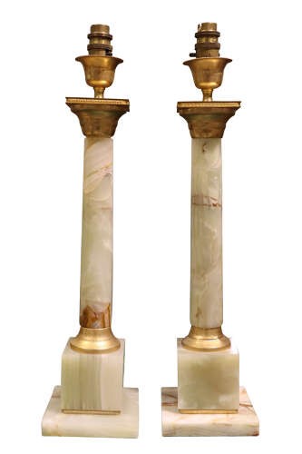 A pair of Neoclassical style table lamps featuring pale green onyx columns mounted with gilt metal capitals and bases, topped with square white lampshades. View II