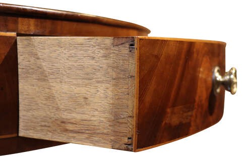 A George IV mahogany corner washstand featuring a stepped splashback with a corner shelf, stringing inlay, curved drawers, and splayed legs. View V