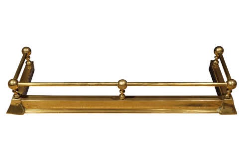 An early twentieth-century brass fireplace fender featuring a raised top rail supported by five spherical ball finials over a moulded rectangular base. View III