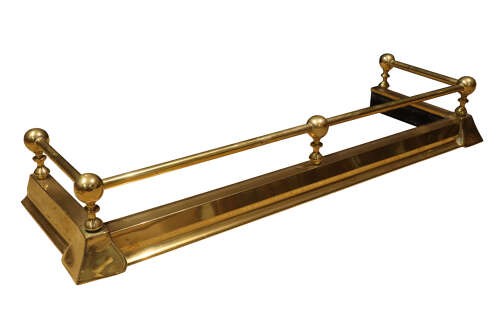 An early twentieth-century brass fireplace fender featuring a raised top rail supported by five spherical ball finials over a moulded rectangular base. View IV