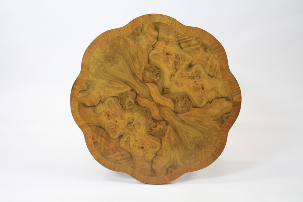 An Art Deco burr walnut nest of tables featuring a cloud-shaped top and four fitted segment side tables underneath. View II