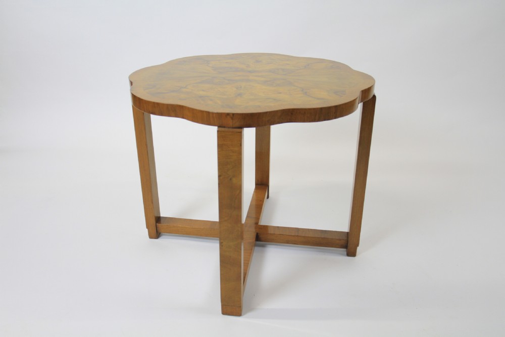 An Art Deco burr walnut nest of tables featuring a cloud-shaped top and four fitted segment side tables underneath. View III