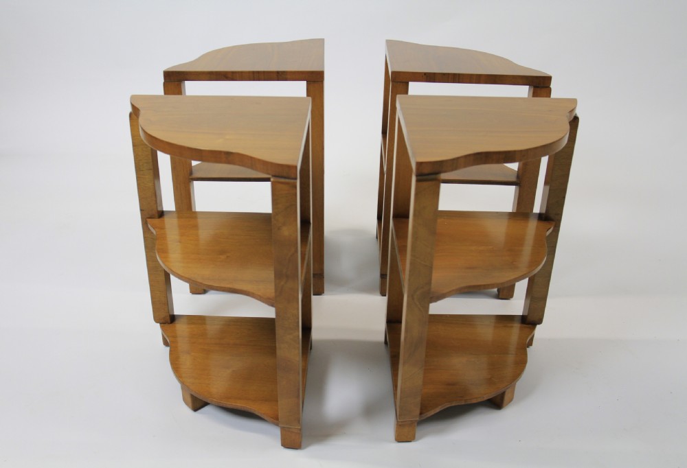 An Art Deco burr walnut nest of tables featuring a cloud-shaped top and four fitted segment side tables underneath. View V